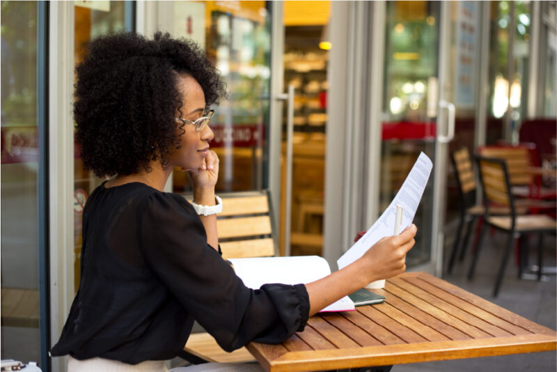 woman reading paperwork